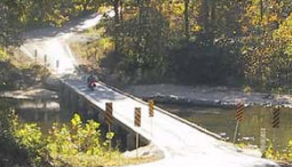 The gravel road and old wooden bridge at Patrick featured